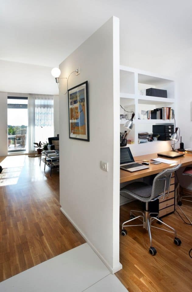 a room with a desk and a bookcase